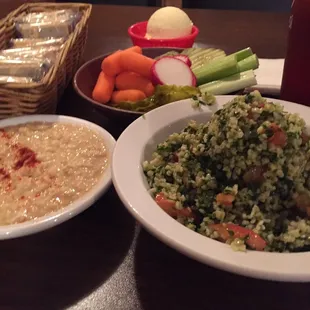 Hummus and Tabouli, also served with a cabbage roll, BBQ bologna and spareribs.