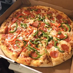 Large pizza with pepperoni, bell peppers