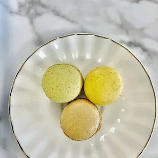three macarons on a plate