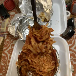 a fork picking up some noodles