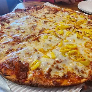 Pepperoni pizza with half banana peppers