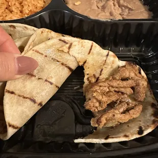 See the shine on the taco shell? That's grease dripping from the bottom of the container. It was so bad...
