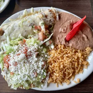 Combo plate of a beef "burrito," chicken tostada, rice and beans