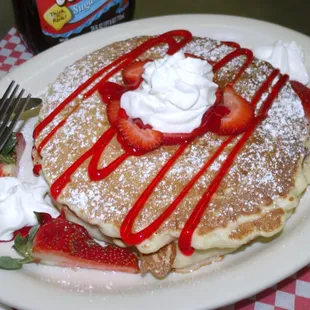 1 or 2 pancakes with powder sugar cool whip and strawberries :)