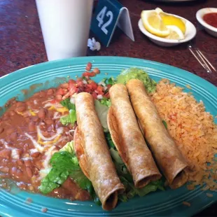 Shredded beef taquitos and combo plate. They add plenty of beef to their thick taquitos. :)