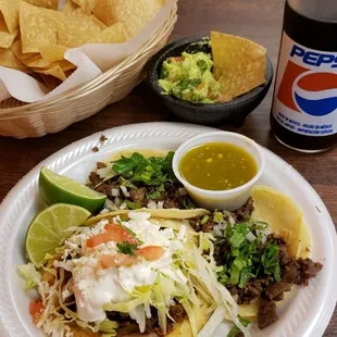 Chips and guacamole. Carne asada tacos, carne asada sope. Mexican Pepsi!