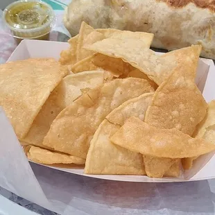 a plate of nachos and chips