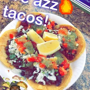 a plate of tacos on a table