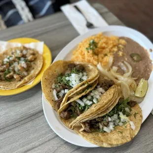Steak taco with rice and beans dinner and fish taco
