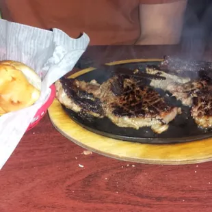Steak with cheese fries as a side.