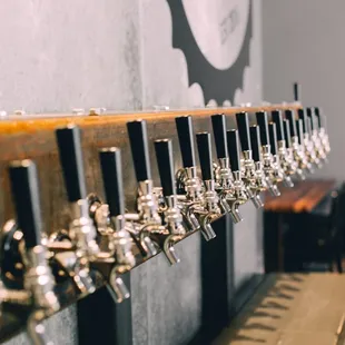 a row of beer taps