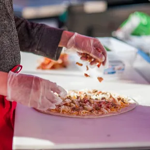 a person making a pizza