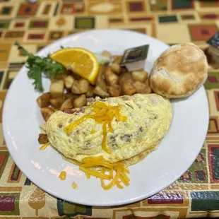 an omelet and potatoes on a plate