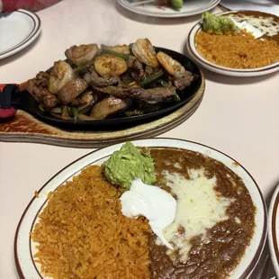 Mixed fajitas, with extra sides. All the meat and the flour tortillas were so good&apos;