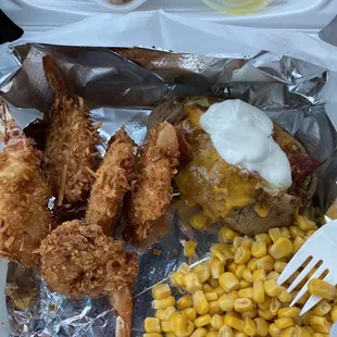Coconut shrimp, loaded baked potato, and corn!