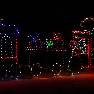 a train decorated with christmas lights