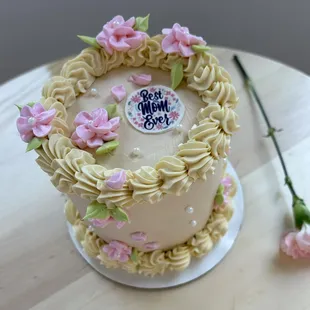 a cake decorated with pink flowers