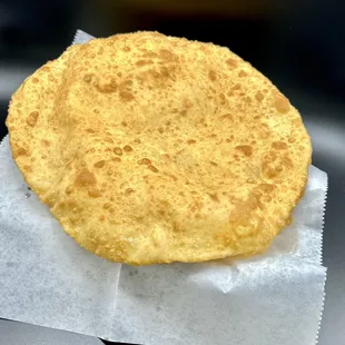 Bhatura (basically a traditional Naan but instead it's fried)