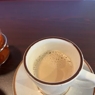 a cup of coffee and a donut