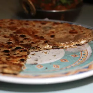 Inside of Paneer Paratha ($7.99) - Bread stuffed with fresh homemade cheese, cilantro and chopped onion delicately spiced.
