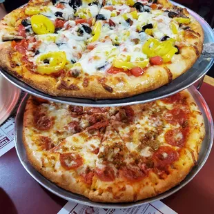 Small veggie on top, medium pepperoni, sausage and extra cheese on bottom!