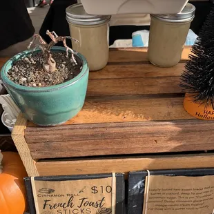 a display of donuts and a potted plant