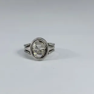 Custom made platinum ring and jacket. Center is an antique rose cut oval shape diamond.