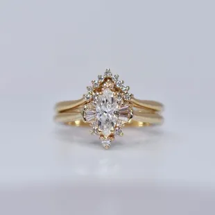 Marquise diamond halo ring with matching wedding band.