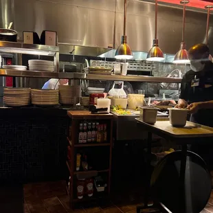 a chef preparing food in the kitchen
