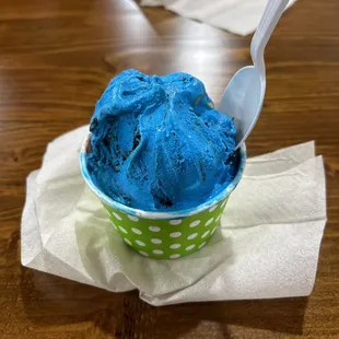 Cookie Monster and Superman ice cream in a large cup.