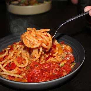 The Amatriciana is made with Spaghetti, Calabrian, Roast Red Pepper &amp; Pancetta.