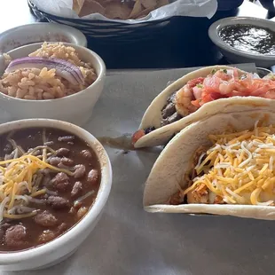 Cantina beans, Spanish rice, buffalo chicken taco and surf n turf taco (best) Chips n salsa in the background