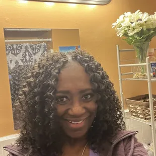 a woman with curly hair