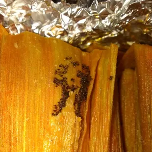 Yes, these are ants in tbe tamales. I bought  1-1/2 port, dozen chicken and a half dozen beef. Each bundle had ants .
