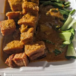 This is called crispy kare kare.It's with lechon kawali with bok choy, long beans and eggplant topped with peanut sauce. I