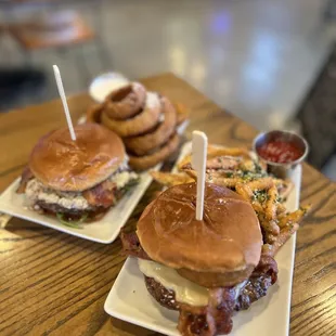 The Blue One Burger with Onion Rings and The Joy Burger with Parmesan Fries