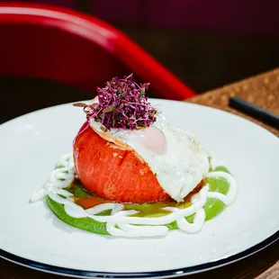 TOMATE A CABALLO. 
Roasted tomato, green rice, shishito purée, fried egg, feta-nata