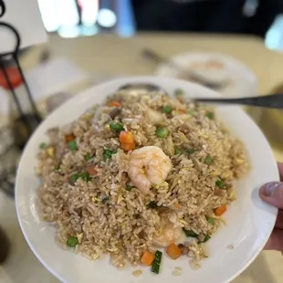 a plate of shrimp fried rice