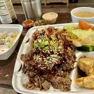 Bento lunch half chicken &amp; half beef teriyaki .all came included with the meal! Delicious!