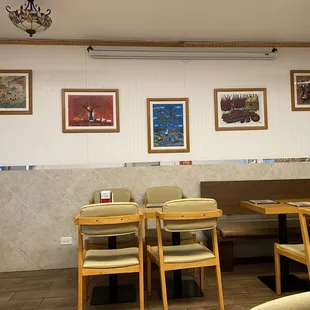 a dining area with tables and chairs