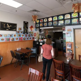 a woman standing in a restaurant