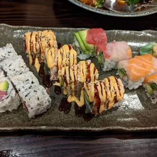 Three sushi rolls, tuna, spicy crab and rainbow