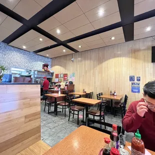 ows a man sitting at a table