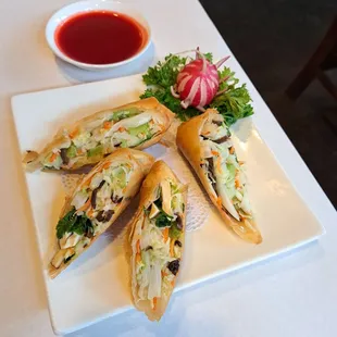 Homemade Vegetarian Spring Rolls. Half order of 2 rolls is $5.50. Full order of 4 rolls is $10.95. Each roll is cut in half.