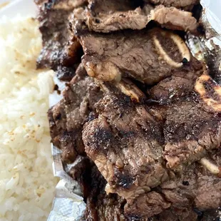 a plate of meat and rice