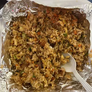 Chicken fried rice half eaten.