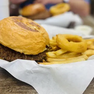 Bacon cheeseburger with fries.