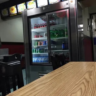 an empty restaurant with a wooden table
