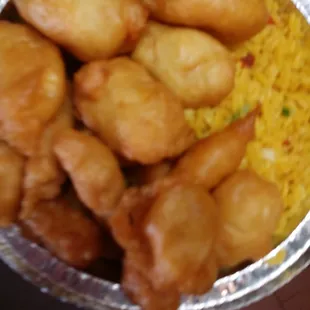 a tray of fried chicken and rice