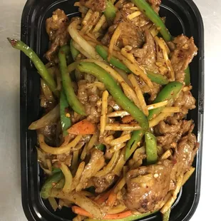 a tray of stir fried beef and green beans